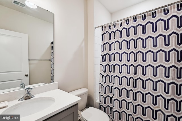 348 Tyson Dr, Berryville, VA 22611 - bathroom with toilet, vanity, and a shower with shower curtain