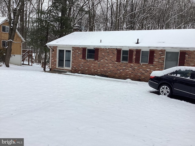 single story home with brick siding