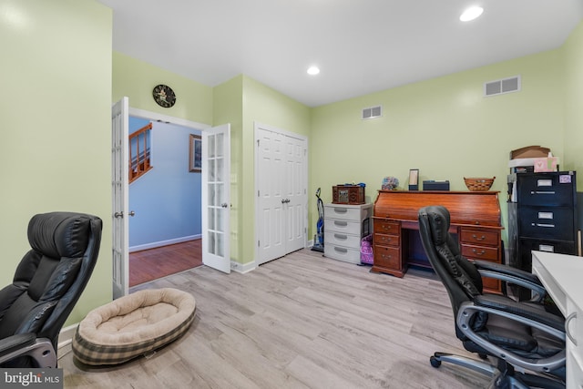 office with recessed lighting, visible vents, and light wood-style flooring