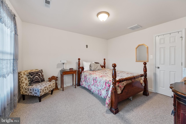 bedroom featuring carpet, visible vents, and baseboards