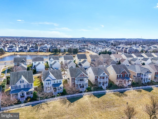 bird's eye view with a residential view and a water view