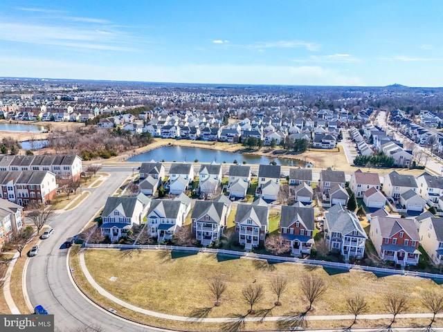 bird's eye view with a residential view and a water view