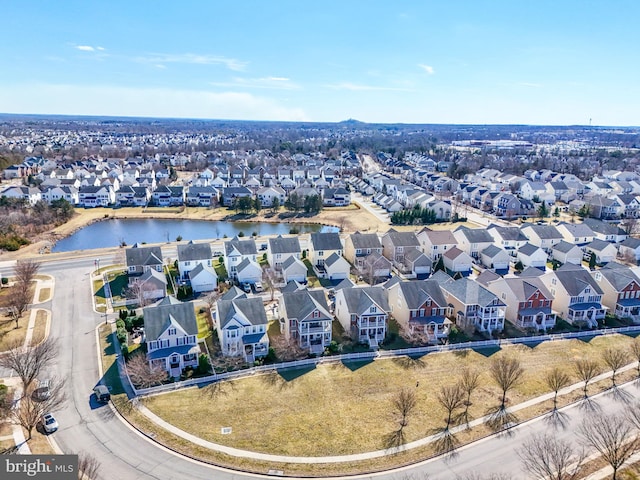 bird's eye view featuring a residential view and a water view