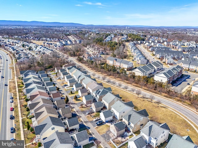 birds eye view of property with a residential view