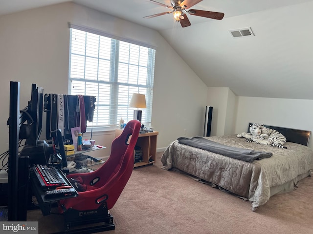 bedroom with visible vents, lofted ceiling, a ceiling fan, and carpet flooring