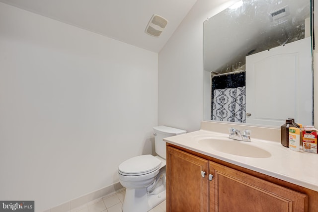 bathroom with tile patterned floors, visible vents, toilet, and vanity