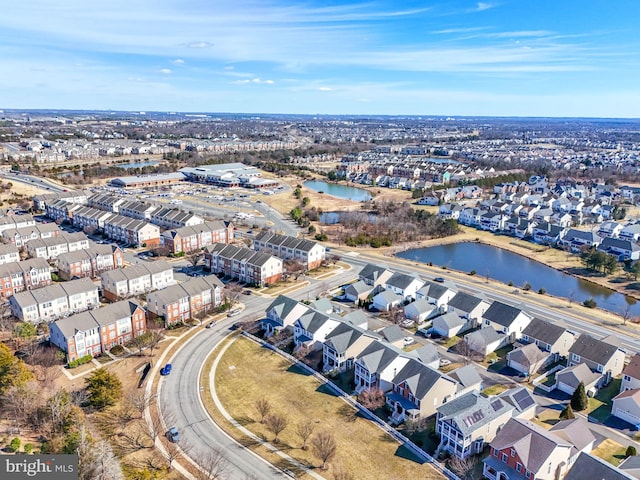 drone / aerial view featuring a residential view and a water view