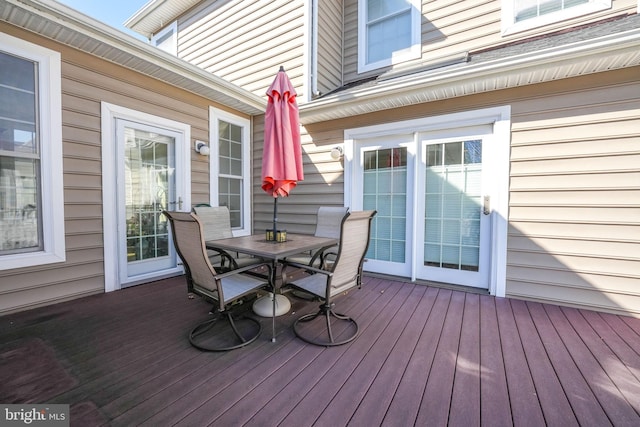 wooden terrace featuring outdoor dining space