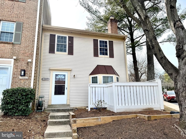 view of front of property with a chimney