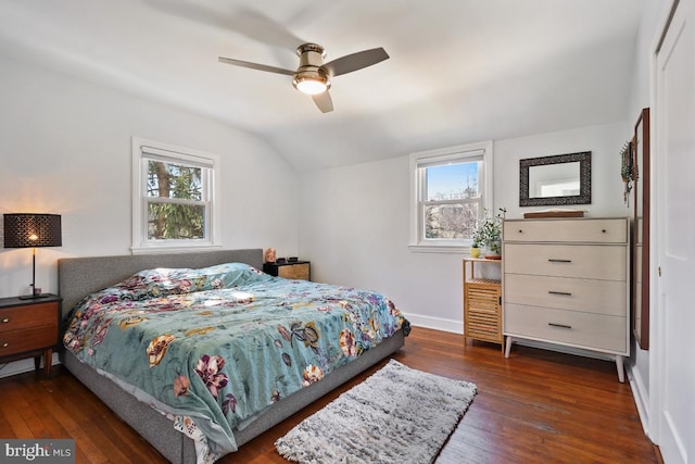 bedroom with baseboards, lofted ceiling, ceiling fan, and hardwood / wood-style flooring