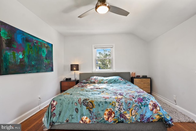 bedroom featuring vaulted ceiling, wood finished floors, and baseboards