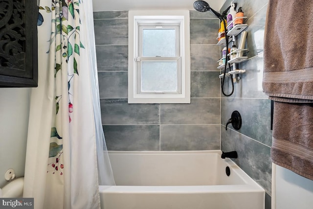 bathroom with shower / tub combo