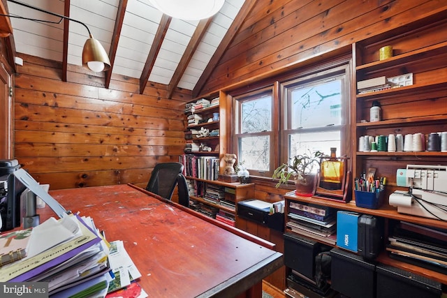 office with lofted ceiling with beams, wood ceiling, and wood walls