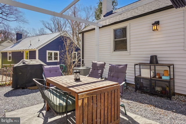 view of patio / terrace featuring outdoor dining space and a grill