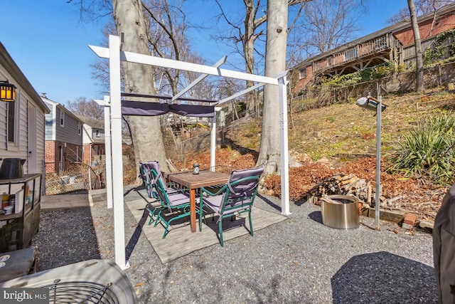 view of patio / terrace featuring outdoor dining area and fence