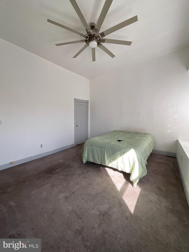 unfurnished bedroom featuring carpet flooring, ceiling fan, and baseboards