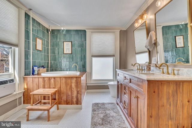 bathroom with a washtub, a sink, tile walls, and double vanity