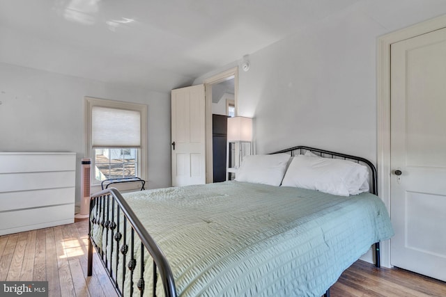 bedroom with light wood finished floors