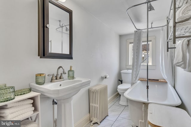 bathroom featuring toilet, baseboards, marble finish floor, a shower with curtain, and radiator heating unit