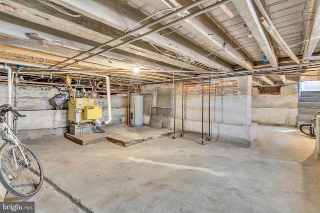 unfinished basement featuring water heater