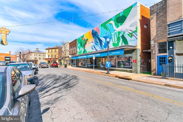 view of street featuring street lighting, curbs, and sidewalks