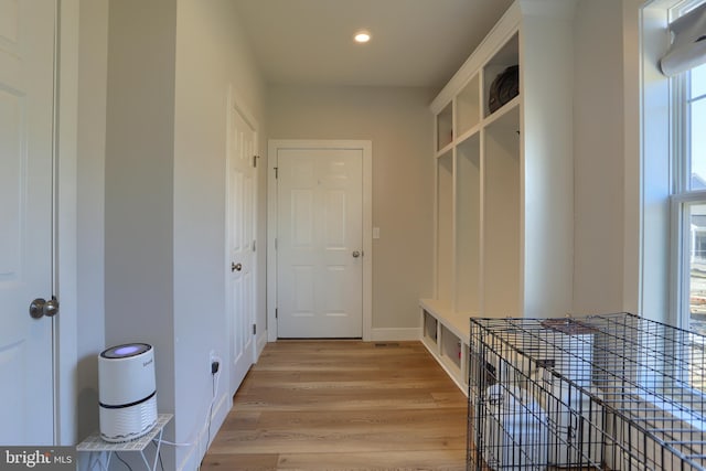 mudroom featuring light wood-style floors, recessed lighting, and baseboards