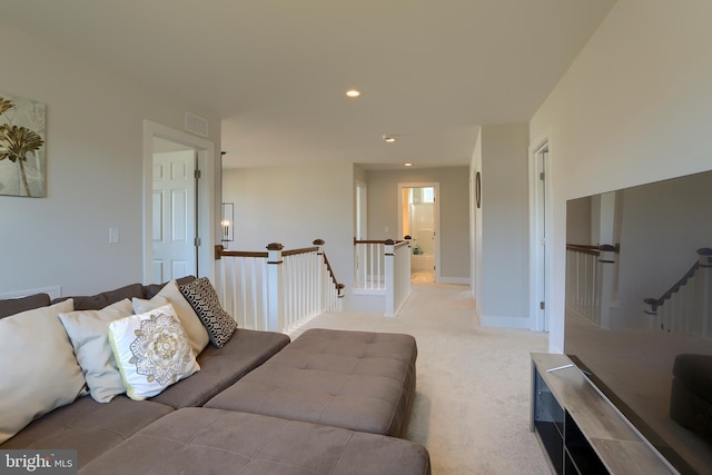 living room featuring light carpet, baseboards, visible vents, and recessed lighting