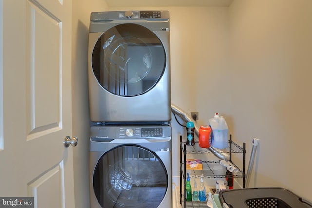 laundry area featuring laundry area and stacked washer and clothes dryer