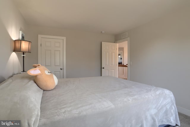 bedroom with visible vents and baseboards