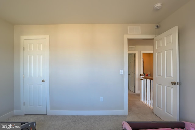 bedroom featuring carpet flooring, visible vents, and baseboards