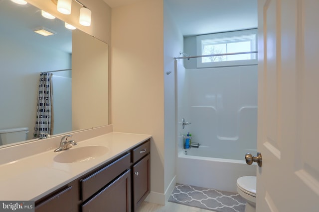 bathroom with vanity, toilet, and bathing tub / shower combination