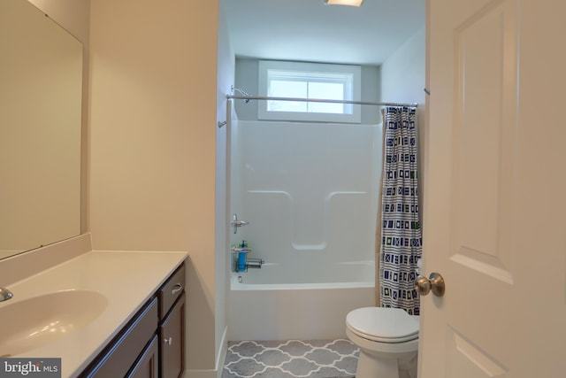 full bathroom with vanity, toilet, and shower / bath combo with shower curtain