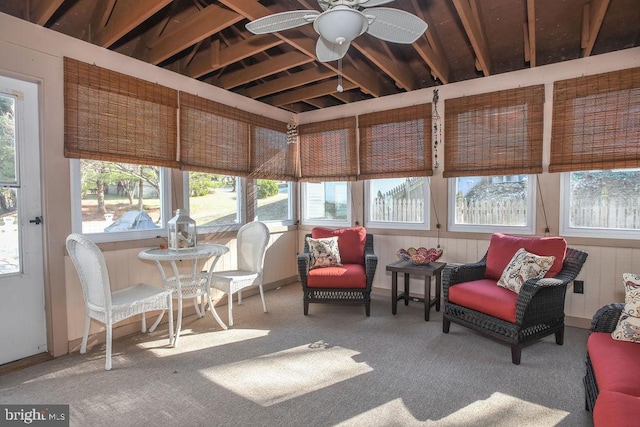 sunroom / solarium featuring a ceiling fan