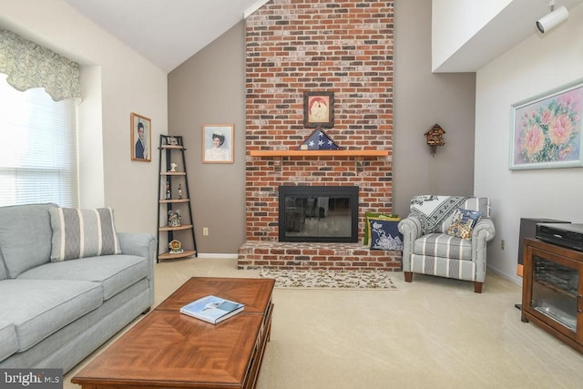 living area with baseboards, a brick fireplace, carpet flooring, and vaulted ceiling