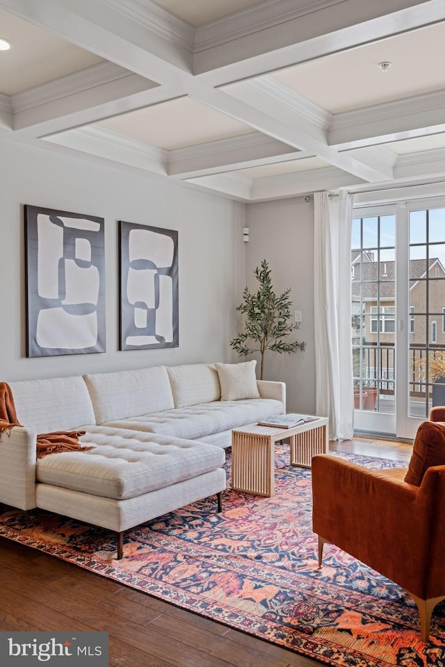 living area with ornamental molding, beam ceiling, coffered ceiling, and hardwood / wood-style flooring