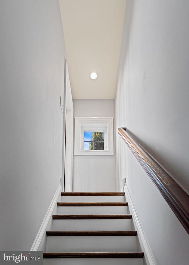 stairway featuring recessed lighting