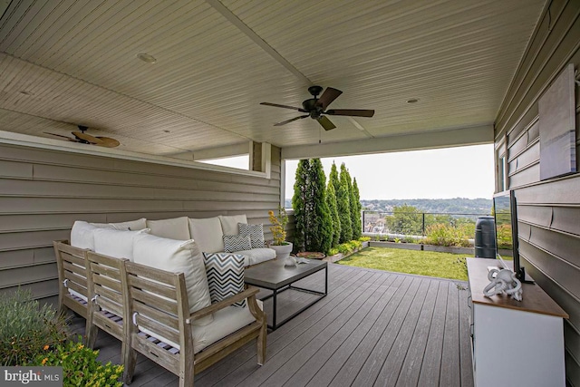 deck with an outdoor hangout area and ceiling fan