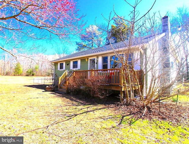 view of front of house featuring a wooden deck