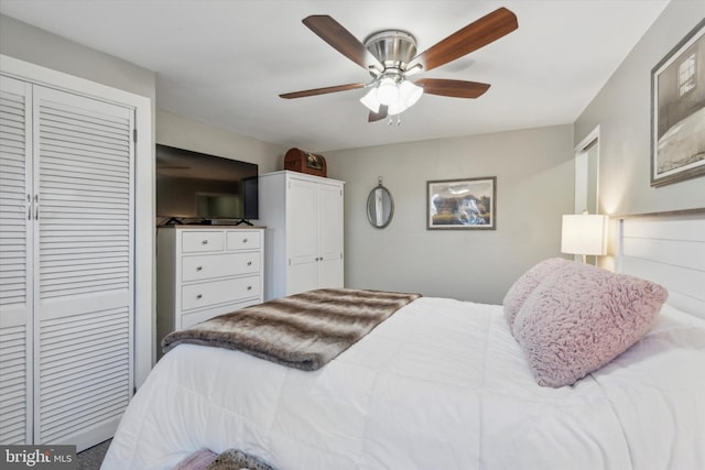 bedroom featuring multiple closets and a ceiling fan