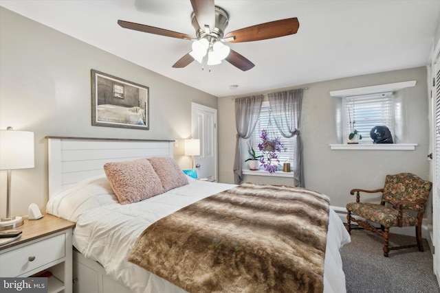 bedroom with ceiling fan and carpet flooring