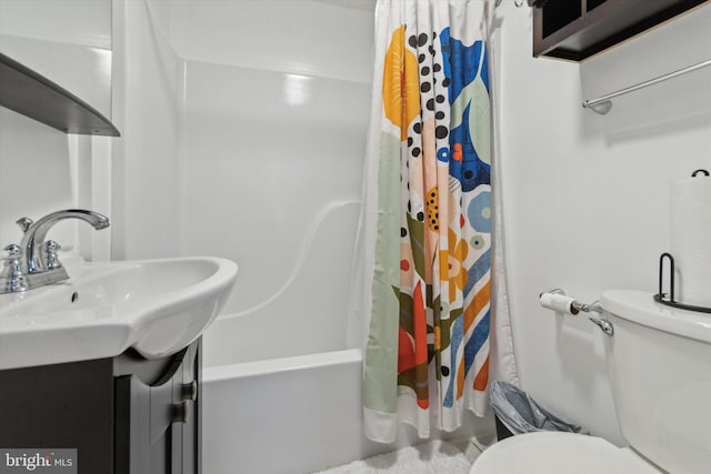 bathroom featuring shower / bath combo with shower curtain, vanity, and toilet