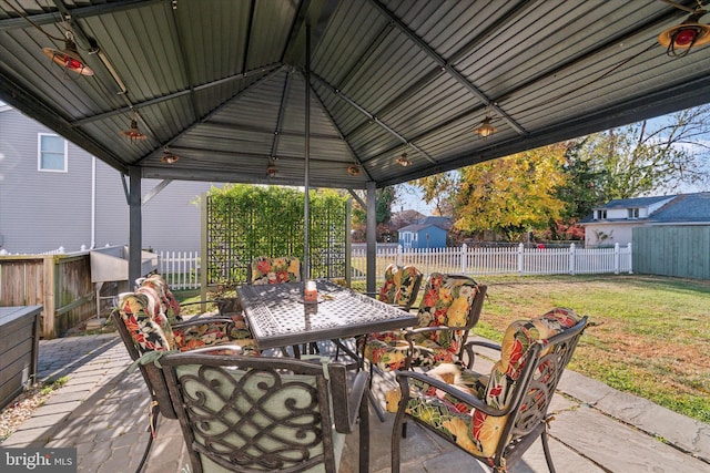 view of patio / terrace with outdoor dining area, a fenced backyard, a gazebo, and area for grilling