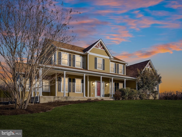 view of front of home featuring a porch and a lawn