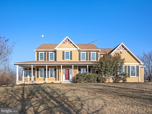 view of front facade with a porch and a front yard