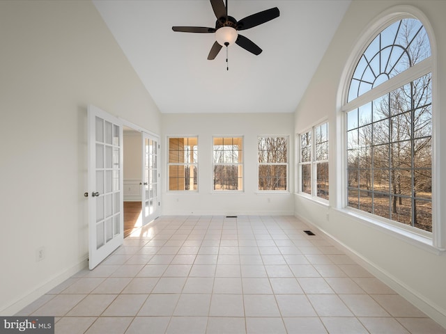 unfurnished sunroom featuring french doors, visible vents, vaulted ceiling, and ceiling fan