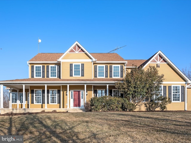 view of front of property featuring a porch and a front yard