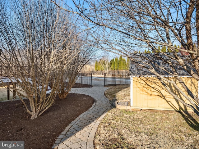 view of yard featuring a gate and fence