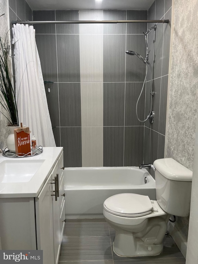 full bath featuring shower / bath combination with curtain, vanity, and toilet