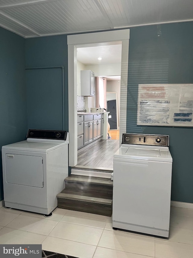 washroom featuring laundry area and light tile patterned flooring