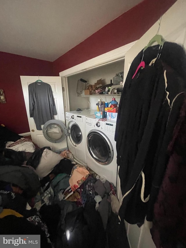 laundry room featuring laundry area and separate washer and dryer